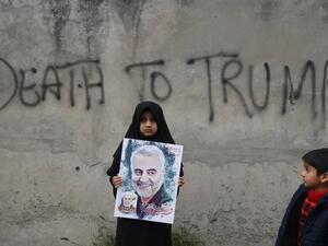 A Shiite Muslim girl holds a poster of Iranian commander Qasem Soleimani as she takes part in a anti-US protest against the killing of top Iranian commander Qasem Soleimani in Iraq, in Lahore on January 12, 2020. (AFP/ File Photo)