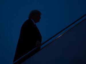 US President Donald Trump boards Air Force One prior to departure from Joint Base Andrews in Maryland, January 14, 2020, as he travels to hold a "Keep America Great" campaign rally in Milwaukee, Wisconsin. SAUL LOEB / AFP