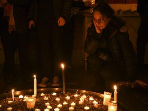 A mourner gathers at a memorial service for the victims of Ukrainian Airlines flight PS752 crash in Iran at Storkyrkan church in Stockholm on January 15, 2020.  Jonathan NACKSTRAND / AFP