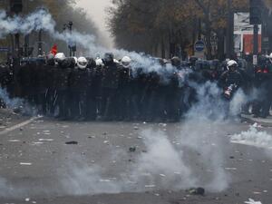 In this file photo taken on December 5, 2019, BRAV police brigades and French gendarmes stand in tear gas during a demonstration against the pension overhauls, in Paris. Zakaria ABDELKAFI / AFP