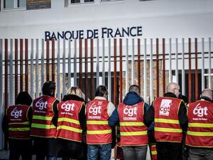 General Confederation of Labour (CGT) unionists of the Banque de France demonstrate outside a bank notes sorting centre of the Banque de France in La Courneuve, outside Paris, on January 22, 2020, as part of a nationwide multi-sector strike against the French government's pensions overhaul. STEPHANE DE SAKUTIN / AFP