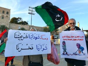 Libyans take part in a demonstration against eastern strongman Khalifa Haftar, and in support of the UN-recognised government of national accord (GNA), in the Martyrs' Square in the GNA-held capital Tripoli on January 24, 2020. AFP