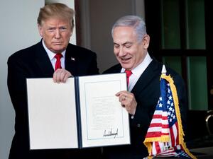 In this file photo taken on March 25, 2019, US President Donald Trump (L) and Israel's Prime Minister Benjamin Netanyahu hold up a Golan Heights proclamation outside the West Wing after a meeting in the White House in Washington, DC. (AFP/ File Photo)
