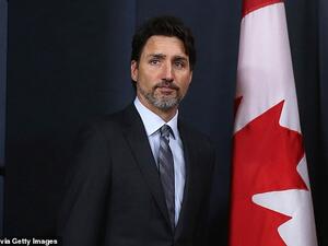 Canadian prime minister Justin Trudeau (pictured) has today blamed the US 'escalation' in the Middle East for the Iranian shoot-down of a passenger jet. (AFP)