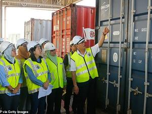 Malaysian environment minister Yeo Bee Yin (front, second from left) inspects a shipping crate containing plastic rubbish today(AFP/ File Photo)
