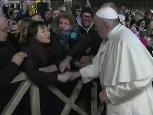 The 83-year-old pope was greeting the faithful in St Peter's Square yesterday when a woman yanked his arm. (Twitter)