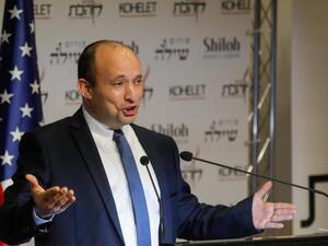 Naftali Bennett, Israel's defence minister, speaks at the Kohelet Policy Forum conference in Jerusalem, 8 January (AFP)