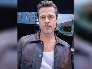 Brad admits he finds fame both "liberating and suffocating"