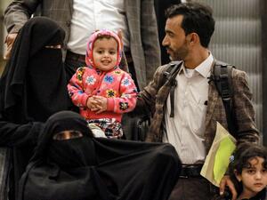 Yemeni children and their guardians arrive after a United Nations medical evacuation from Sanaa at Queen Alia International Airport, south of the Jordanian capital Amman, on February 3, 2020, in what the UN hopes will be the first of many "mercy flights". Seven young patients and their relatives flew out of Sanaa airport, which a Saudi-led coalition supporting the embattled Yemeni government has kept closed to commercial flights since 2016. The UN-marked plane later landed in the Jordanian capital Amman, wh