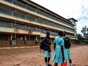 A group of pupils from Kakamega Primary School in western Kenya wait to be picked up by their parents on February 4, 2020 outside their classrooms. AFP