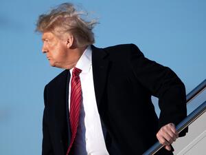 US President Donald Trump boards Air Force One prior to departure from Joint Base Andrews in Maryland, February 14, 2020, as he travels to Mar-a-lago in Florida for the weekend. SAUL LOEB / AFP