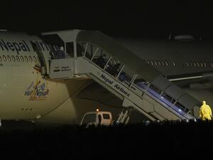 Nepali students who were repatriated from Wuhan, China amid the novel coronavirus COVID-19 outbreak, arrive at the Tribhuvan International Airport in Kathmandu on February 16, 2020. PRAKASH MATHEMA / AFP