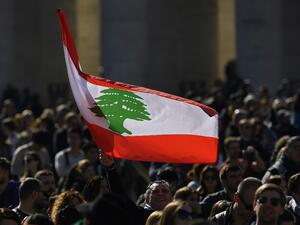 An attendee waves the flag of Lebanon during the Pope's weekly Angelus prayer on February 16, 2020 at St. Peter's Square in the Vatican. Filippo MONTEFORTE / AFP