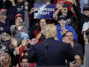 Supporters cheer as U.S. President Donald Trump arrives for a "Keep America Great" rally at Southern New Hampshire University Arena on February 10, 2020 in Manchester, New Hampshire. New Hampshire will hold its first in the national primary on Tuesday. Drew Angerer/Getty Images/AFP
