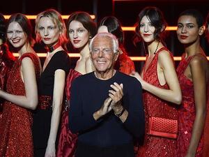 Giorgio Armani (pictured in Milan yesterday) has been criticised for saying women are being 'raped' by designers who push them to wear provocative clothing (AFP)
