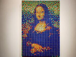The street art Rubik's Cube version of the 'Mona Lisa' entitled 'Rubik Mona Lisa' made in 2005 by French artist Invader on display at the Artcurial auction house in Paris. The artwork was sold for 480,000 euros (£403,000) on Sunday evening (dailymail)