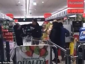 Scuffle: A fight broke out (pictured above) in an Italian supermarket, said to be inside the 'red zone' in northern Italy where 50,000 people have been placed in quarantine. (Facebook)
