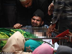 The brother (centre) of Mohammad MudAsir, 31, who died in the recent sectarian riots in India's capital over Prime Minister Narendra Modi's citizenship law, reacts during his brother's funeral in New Delhi today. AFP