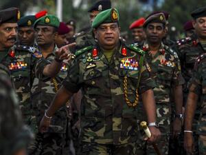 In this Jan 14, 2020, Sri Lanka's Army chief Shavendra Silva (center) arrives to supervise the military operation to revive abandoned rice paddies. (AFP)