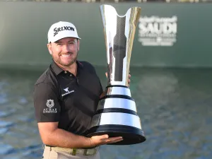 McDowell celebrates with the Saudi International trophy