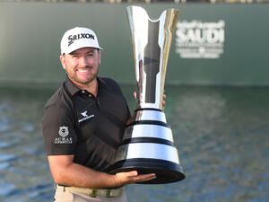 McDowell celebrates with the Saudi International trophy