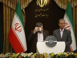 Iranian Deputy Health Minister Iraj Harirchi (L) wipes the sweat off his face, during a press conference with the Islamic republic's government spokesman Ali Rabiei in the capital Tehran on February 24, 2020. AFP/File