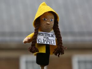 A activist holds a doll depicting Swedish climate activist Greta Thunberg during a "Youth Strike 4 Climate" protest march in Bristol, south west England on February 28, 2020. "Activism works, so I ask you to act": young Swedish climate activist Greta Thunberg called on young British people to rally during a climate march on Friday in Bristol. GEOFF CADDICK / AFP