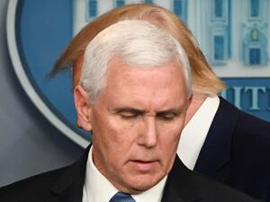 US President Donald Trump walks past US Vice President Mike Pence (L) during a press conference on the COVID-19, coronavirus, outbreak at the White House in Washington, DC on February 29, 2020. The number of novel coronavirus cases in the world rose to 85,919, including 2,941 deaths, across 61 countries and territories by 1700 GMT on Saturday, according to a report gathered by AFP from official sources. Roberto SCHMIDT / AFP