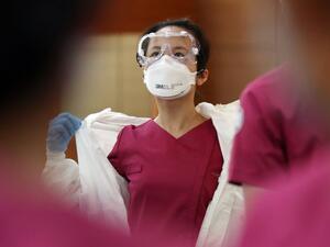 New nurse officers are trained on the COVID-19 coronavirus before heading to Daegu to help medical staff, at the Korea Armed Forces Nursing Academy in Daejeon on March 2, 2020. South Korea confirmed 599 new coronavirus cases on March 2, taking the total to 4,335, health authorities said, while the death toll rose by eight to 26. YONHAP / AFP