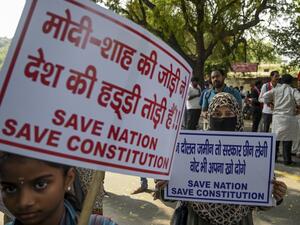 Protesters hold placards during a protest against India's new citizenship law in New Delhi on March 4, 2020. Sajjad HUSSAIN / AFP