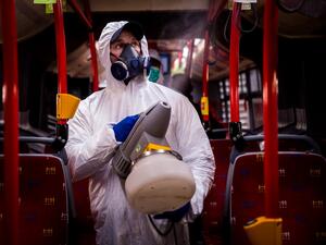 A worker wearing protective clothes disinfects an interior of a public bus in a bus-wash station at Transport Company of Bratislava city as part of precautionary measures against the spread of the new coronavirus COVID-19 in Bratislava, Slovakia on March 11, 2020. Many schools were closed and public events were cancelled due to the coronavirus outbreak in Slovakia as first seven cases of infection were confirmed. VLADIMIR SIMICEK / AFP