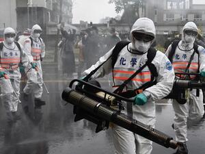 Soldiers from the military’s chemical units take part in a drill organised by the New Taipei City government to prevent the spread of the COVID-19 coronavirus, in Xindian district on March 14, 2020. Over 450 medical staff, community volunteers, government employees and military personnel took part in the drill. Despite being so close to the original outbreak in mainland China, Taiwan has just 48 confirmed cases of the Covid-19 disease with one death.  Sam Yeh / AFP