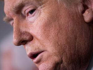 US President Donald Trump listens to a question during a COVID-19 pandemic briefing at the White House March 16, 2020, in Washington, DC. The first human trial to evaluate a candidate vaccine against the new coronavirus has begun in Seattle, US health officials said, raising hopes in the global fight against the disease. Brendan Smialowski / AFP