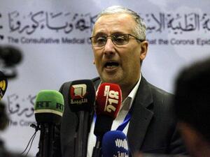 Ahmed al-Hassi, spokesman for the medical committee to combat COVID-19 coronavirus disease in Libya's eastern city of Benghazi, speaks during a press conference on March 20, 2020 announcing updates on figures for suspected cases. Abdullah DOMA / AFP
