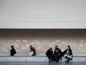 Tourists wearing a protective mask are seen at the Metropolitan Museum of Art on March 10, 2020 in New York City on March 12, 2020 in New York City. The museum announced it will be closed Friday because of the COVID-19 pandemic. Jeenah Moon/Getty Images/AFP Jeenah Moon / GETTY IMAGES NORTH AMERICA / AFP