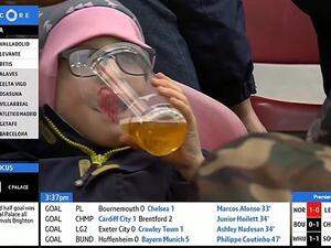 A child was spotted sinking a pint during a Bundesliga match on Saturday afternoon  (Dailymail)