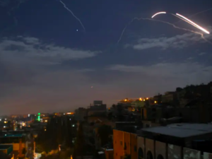 Syrian air defence batteries responding to what the Syrian state media said were Israeli missiles targeting Damascus, in a picture taken early on January 21st, 2019 (STR / AFP)