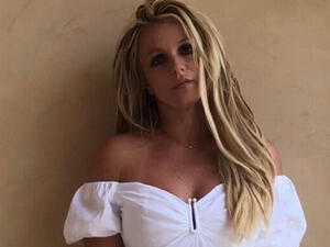 her dice ink is visible near her left wrist 