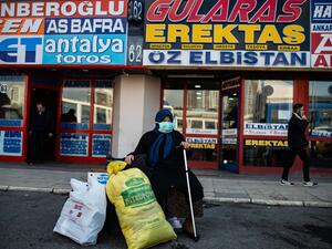 A woman wearing a protective face mask waits at the Esenler bus terminal in Istanbul, on March 14, 2020, during the outbreak of COVID-19, the new coronavirus. Turkey will halt flights with nine European countries the transport minister said on March 13, after having already shut all schools for two weeks and bar spectators from football matches through April, as part of Ankara's bid to contain the spread of the new coronavirus. Yasin AKGUL / AFP