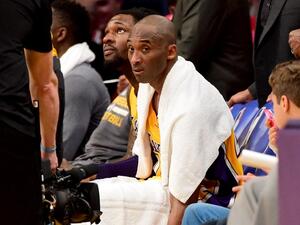 In this file photo Kobe Bryant #24 of the Los Angeles Lakers looks on from the bench late in the fourth quarter against the Utah Jazz at Staples Center on April 13, 2016 in Los Angeles, California. The towel that Kobe Bryant wore over his shoulders during his farewell speech after his final National Basketball League game has fetched over $33,000 at auction, the US media said on March 29, 2020.With the towel draped around him to help mop up his sweat, the Los Angeles Lakers superstar closed his speech with 