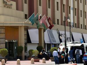 Mask-clad guests who were in quarantine depart the Mena Hotel in Riyadh on March 30, 2020. Saudi Arabia has quarantined thousands of people in hotels, some in luxury suites, to combat COVID-19, throwing a temporary lifeline to an industry struggling just months after tourist visas were launched. Faced with nearly 4,500 novel coronavirus infections -- the highest in the Gulf -- the petro-state has halted air travel, locked down cities and imposed nationwide curfews in a crisis that has dealt a blow to the na