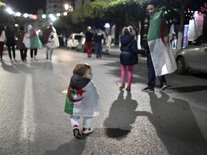 In this file photo taken on April 2, 2019, Algerians celebrate in the capital Algiers after the country's veteran President Abdelaziz Bouteflika informed the Constitutional Council that he was resigning. A year after the unexpected downfall of Algeria's longtime president Abdelaziz Bouteflika, the ailing octogenarian remains holed up in his medically adapted and upmarket home, with his detractors still demanding justice. RYAD KRAMDI / AFP