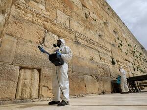 Workers sanitise the Western Wall, the most holy site where Jews can pray on March 31, 2020 against the spread of the coronavirus COVID-19 in Jerusalem. Emmanuel DUNAND / AFP