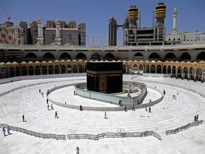 Muslim worshippers circumambulate the sacred Kaaba in Mecca's Grand Mosque, Islam's holiest site, on April 3, 2020. Saudi Arabia on April 2 extended curfew restrictions on Islam's two holiest cities to 24 hours to stem the spread of coronavirus as the number of deaths from the disease rose to 21. AFP