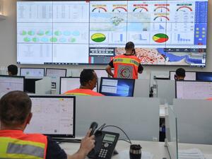 Employees of the COVID-19 coronavirus disease operations room of the Saudi Red Crescent (SRC) are seen while on duty in the Saudi capital Riyadh, on April 6, 2020. The SRC increased their employees to meet the increased demand on ambulances since the novel coronavirus appeared and the kingdom imposed a curfew. FAYEZ NURELDINE / AFP