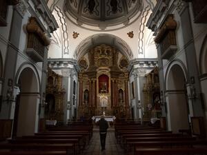 A man visits "Los Descalzos" church in Ronda on April 7, 2020, as Holy Week processions were cancelled during a national lockdown to prevent the spread of the COVID-16 outbreak. AFP