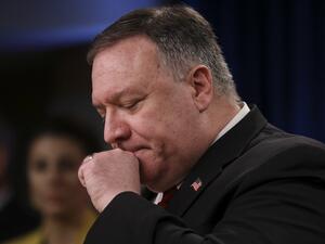 US Secretary of State Mike Pompeo clears his throat as he addresses a news conference at the State Department in Washington,DC on April 7, 2020. LEAH MILLIS / POOL / AFP
