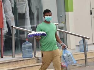 A worker delivers groceries during a nationwide curfew to stem the spread of COVID-19 in the Saudi capital Riyadh on April 13, 2020, ahead of the holy Muslim fasting month of Ramadan. (AFP)
