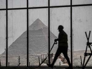 A picture taken on April 13, 2020, shows a view of the Great pyramid of Khafre (Chephren) seen through the scaffolding on the Grand Egyptian Museum (GEM), which is currently under construction, in Giza on the southwestern outskirts of the capital Cairo. Khaled DESOUKI / AFP