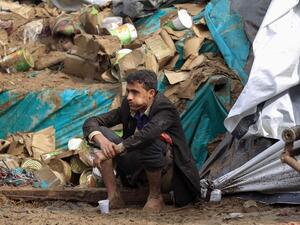 A Yemeni street vendor looks at his damaged stall due to floods following heavy rains in the capital Sanaa, on April 14, 2020. Mohammed HUWAIS / AFP